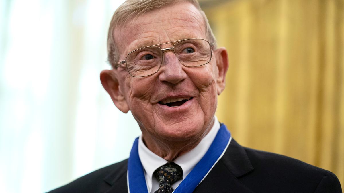 Former football coach Lou Holtz smiles after receiving the Presidential Medal of Freedom from President Donald Trump, in the Oval Office of the White House, Thursday, Dec. 3, 2020, in Washington. (AP Photo/Evan Vucci)
