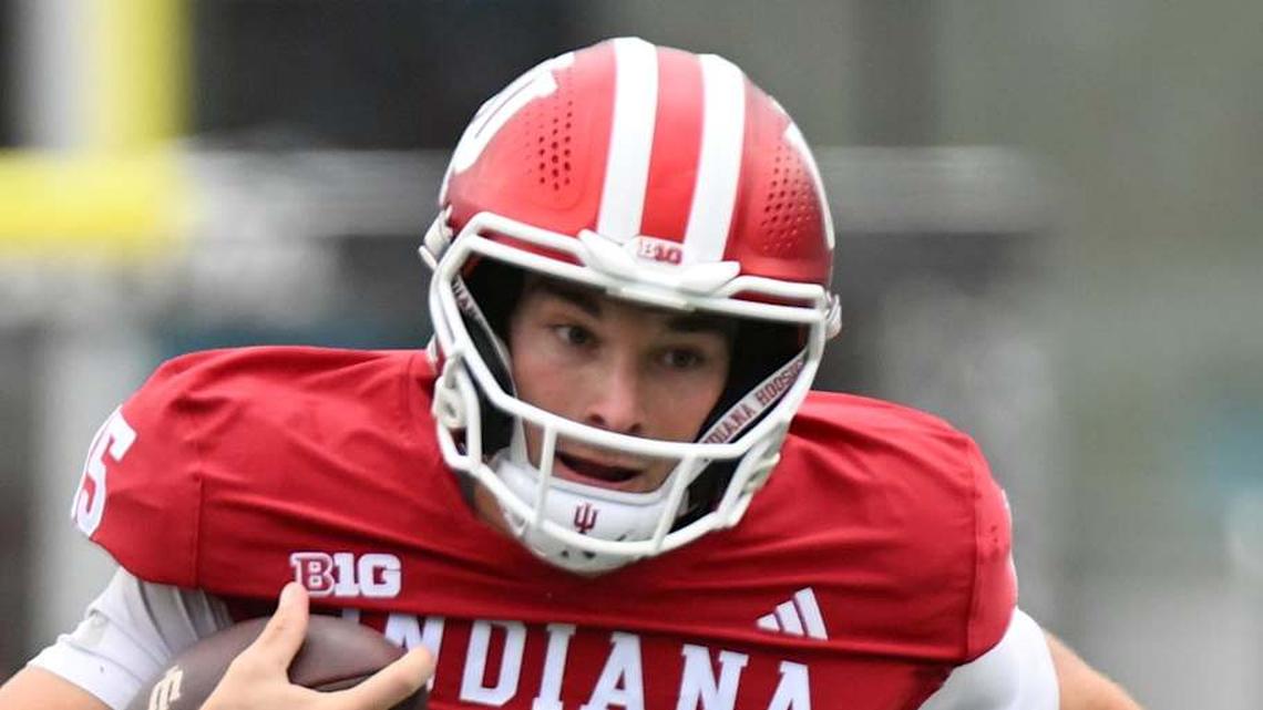  Oct 25, 2025; Bloomington, Indiana, USA; Indiana Hoosiers quarterback Fernando Mendoza (15) runs the ball during the second half against the UCLA Bruins at Memorial Stadium. Mandatory Credit: Robert Goddin-Imagn Images | Robert Goddin-Imagn Images 