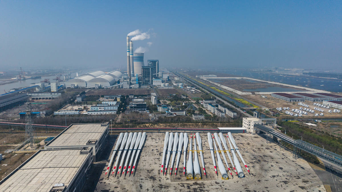 FILE -- Wind turbine blades in a stockyard in Sheyang Port in Yancheng, China, April 2, 2026. Chinese companies dominate the manufacturing of nearly every component of a modern power grid. (Qilai Shen/The New York Times)