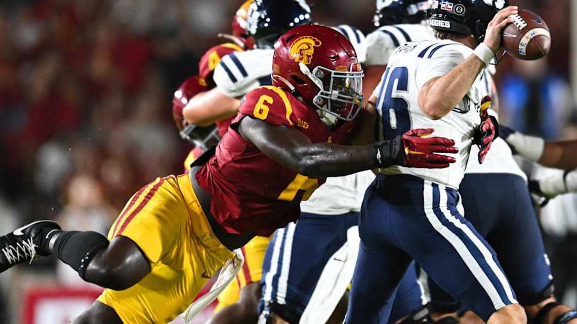  Sep 7, 2024; Los Angeles, California, USA; USC Trojans defensive end Anthony Lucas (6) attempts to sack Utah State Aggies quarterback Bryson Barnes (16) during the second quarter at United Airlines Field at Los Angeles Memorial Coliseum. Mandatory Credit: Jonathan Hui-Imagn Images | Jonathan Hui-Imagn Images 