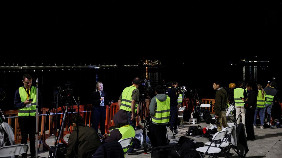 Members of the media await the arrival of the cruise ship MV Hondius at the port of Granadilla de Abona after being affected by a hantavirus outbreak, in Tenerife, Spain, May 10, 2026. REUTERS/Hannah McKay