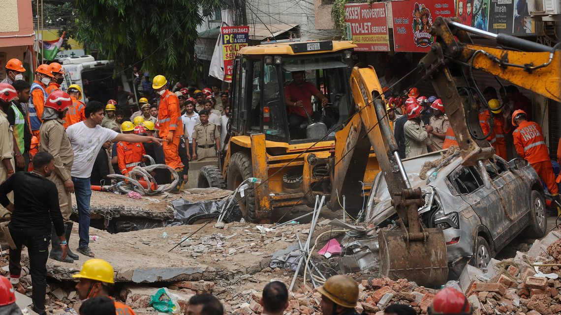 Six killed in Delhi building collapse, rescuers search through rubble 