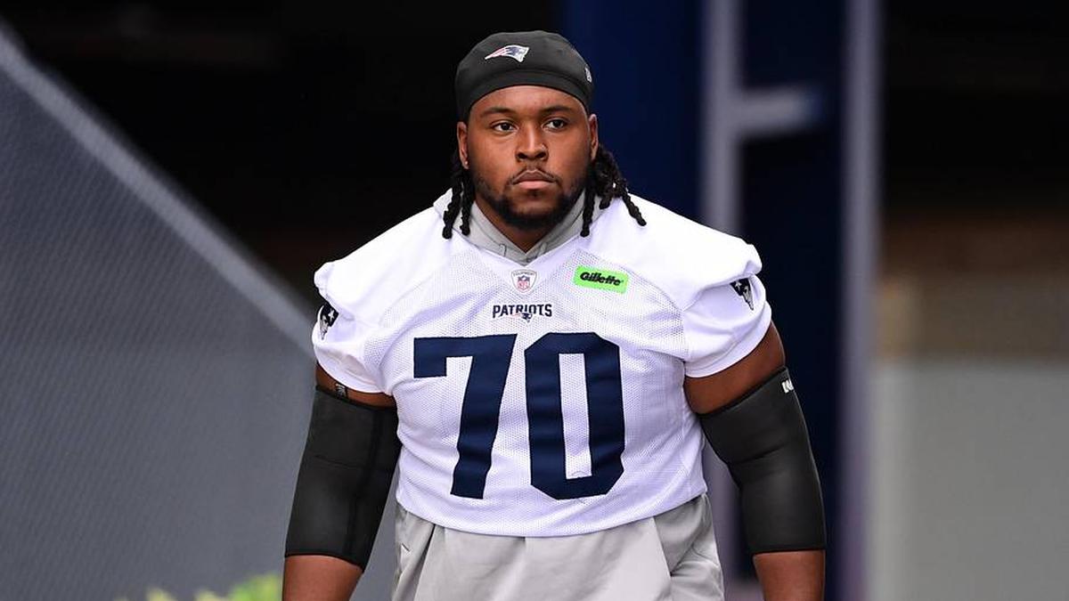  Jul 24, 2024; Foxborough, MA, USA; New England Patriots offensive tackle Caedan Wallace (70) walks to the practice field during training camp at Gillette Stadium. Mandatory Credit: Eric Canha-Imagn Images | Eric Canha-Imagn Images 