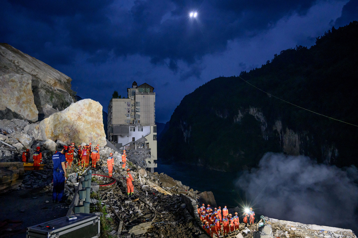 Rescue workers search for survivors at the site of a landslide along Wujiang river in Pengshui Miao and Tujia Autonomous County, Chongqing, China July 17, 2026. cnsphoto via REUTERS