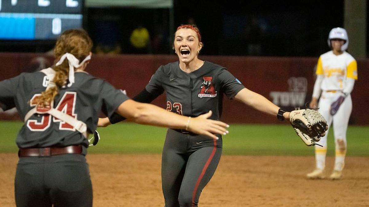  May 23, 2026; Tuscaloosa, AL, USA; Alabama catcher Marlie Giles (34) and Alabama pitcher Jocelyn Briski (23) jump into each others arms after the Tuscaloosa NCAA Super Regional between Alabama and LSU. Alabama advanced to the College World Series with a 4-1 victory and a series sweep. | Gary Cosby Jr.-Tuscaloosa News / USA TODAY NETWORK via Imagn Images 