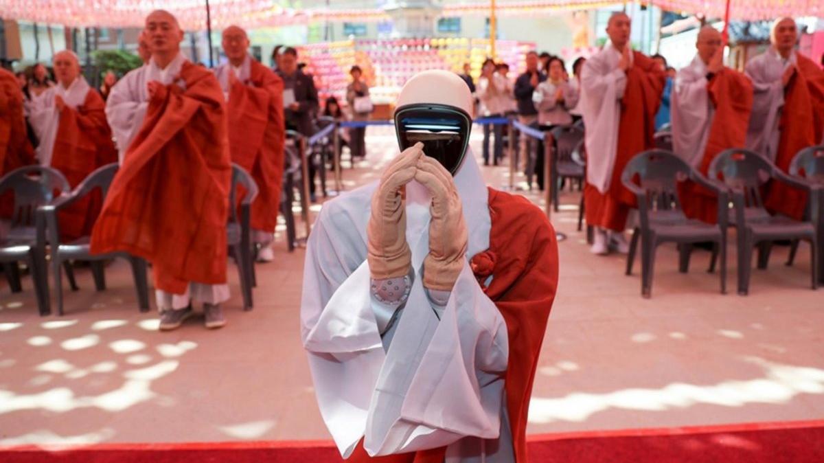 Gabi, a humanoid robot, puts its hands together with a group of Buddhist monks during an ordination ceremony at Jogye Temple in Seoul, South Korea, 06 May 2026. Photo by YONHAP / EPA