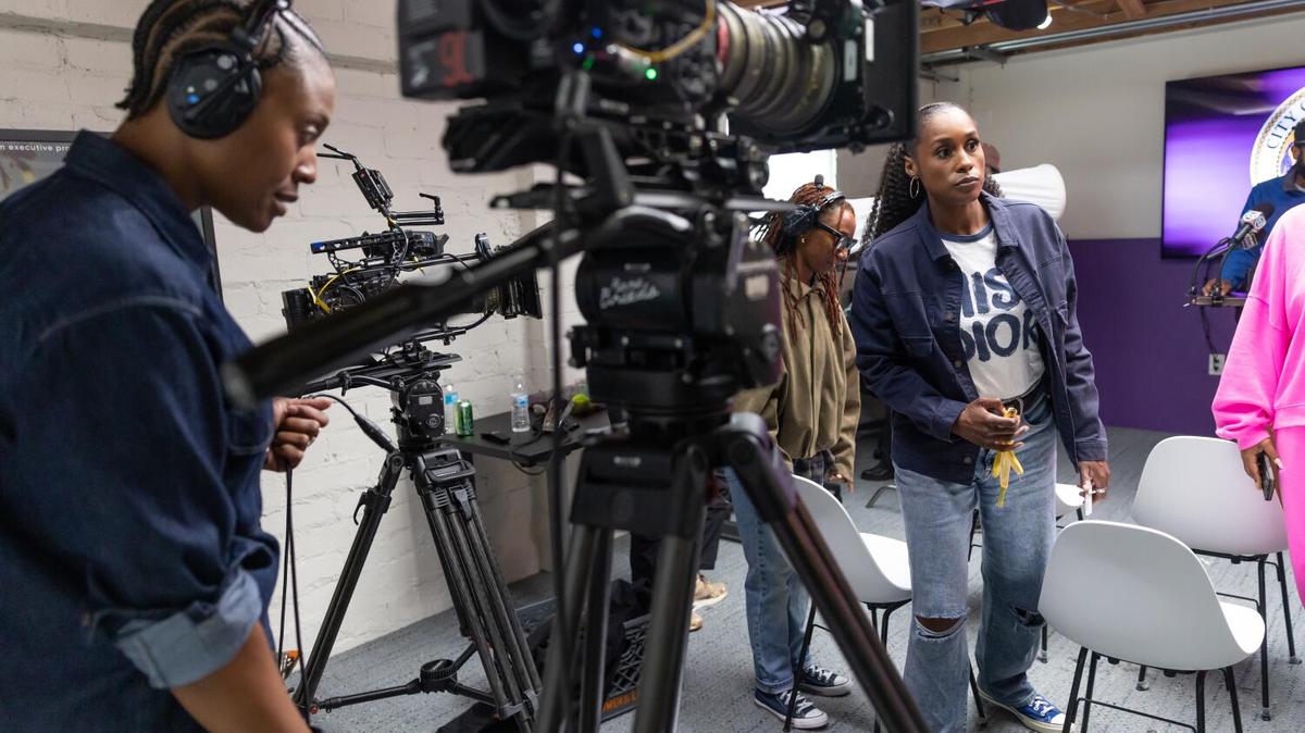 LOS ANGELES, CA - MAY 15, 2026: Camera operator Briana Monat, left, director of photography Brittney Janae Butler, center, and Issa Rae, at right, on set during 'Screen Time' production at Hoorae's office in Los Angeles on Friday, May 15, 2026. Issa Rae's new micro-drama series on TikTok called Screen Time is projected to be the biggest series ever for TikTok, based on viewership. (Christina House / Los Angeles Times)