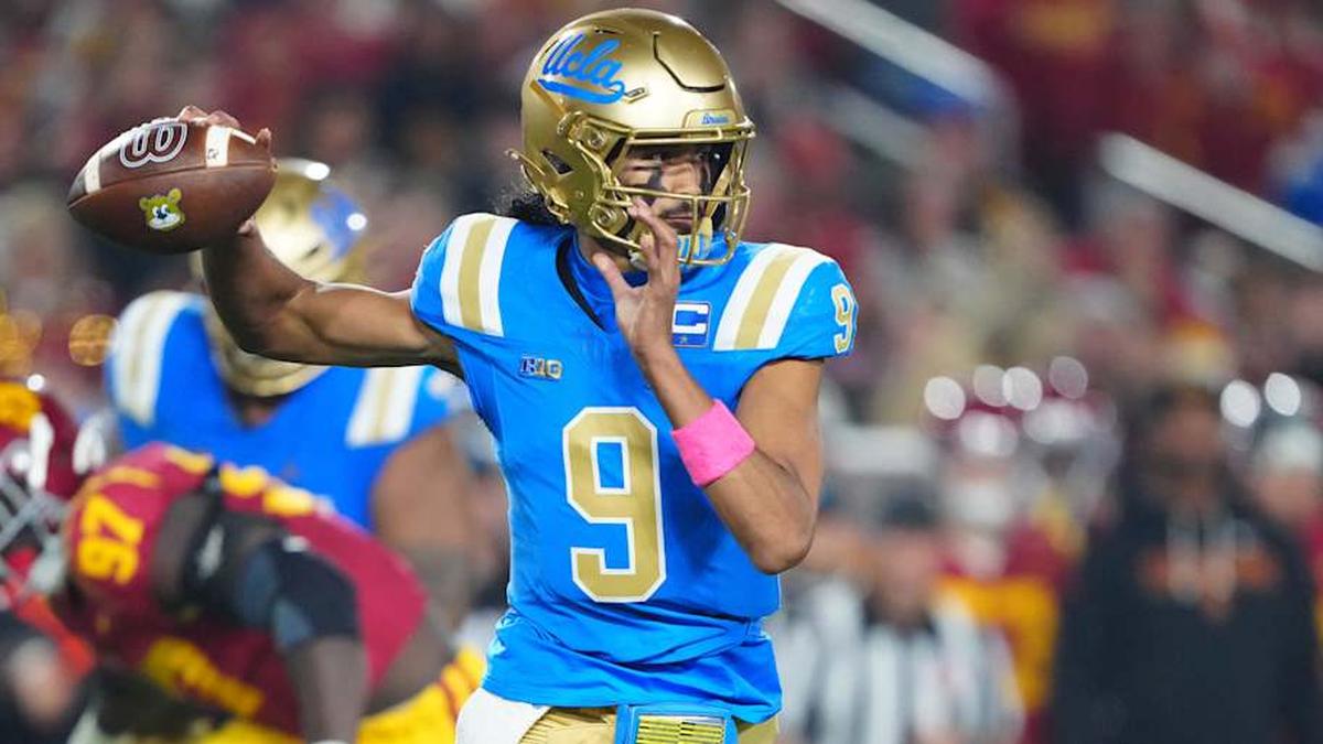  Nov 29, 2025; Los Angeles, California, USA; UCLA Bruins quarterback Nico Iamaleava (9) throws the ball against the Southern California Trojans in the first half at United Airlines Field at Los Angeles Memorial Coliseum. Mandatory Credit: Kirby Lee-Imagn Images | Kirby Lee-Imagn Images 