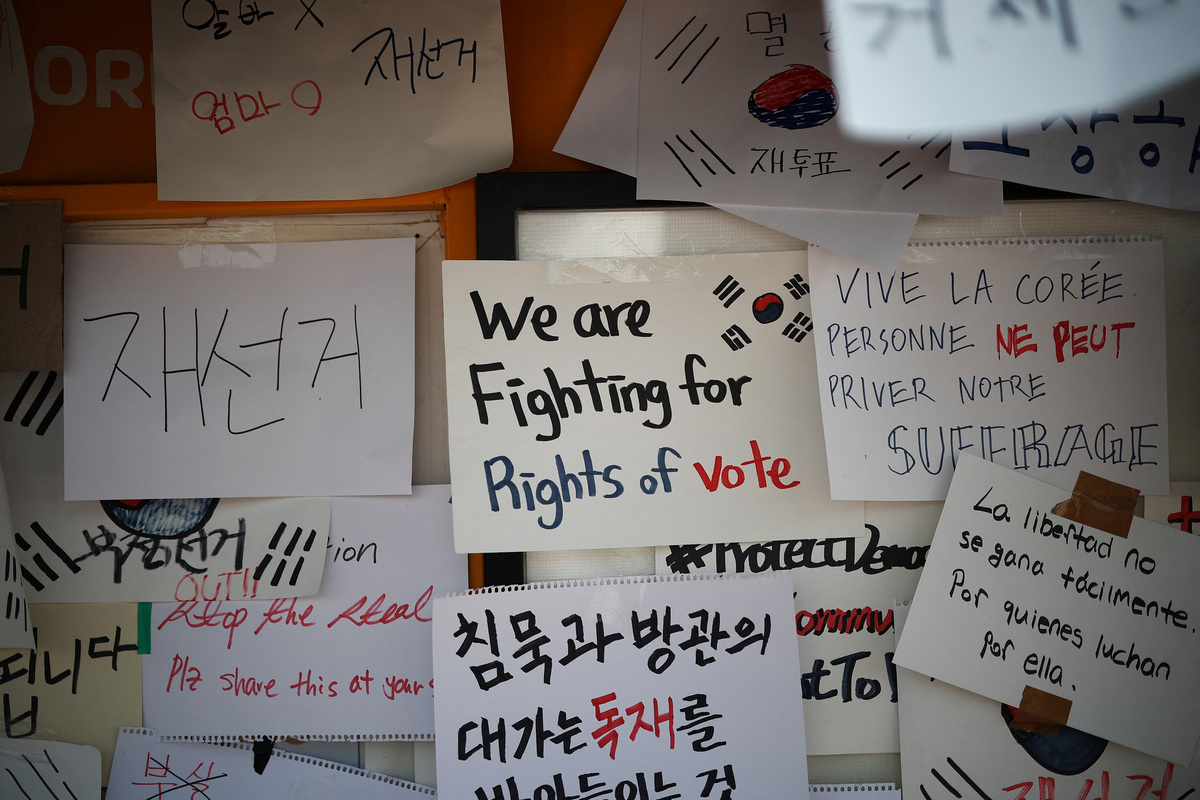 Hand-written signs outside vote-counting centre during a protest to demand a rerun of the local election, amid a ballot paper shortage that disrupted voting, in Seoul, South Korea, June 10, 2026. REUTERS/Kim Hong-Ji