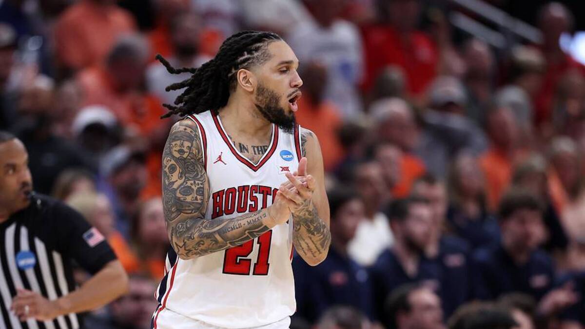  Mar 26, 2026; Houston, TX, USA; Houston Cougars guard Emanuel Sharp (21) reacts in the first half during a Sweet Sixteen game of the South Regional of the men's 2026 NCAA Tournament at Toyota Center. Mandatory Credit: Troy Taormina-Imagn Images | Troy Taormina-Imagn Images 