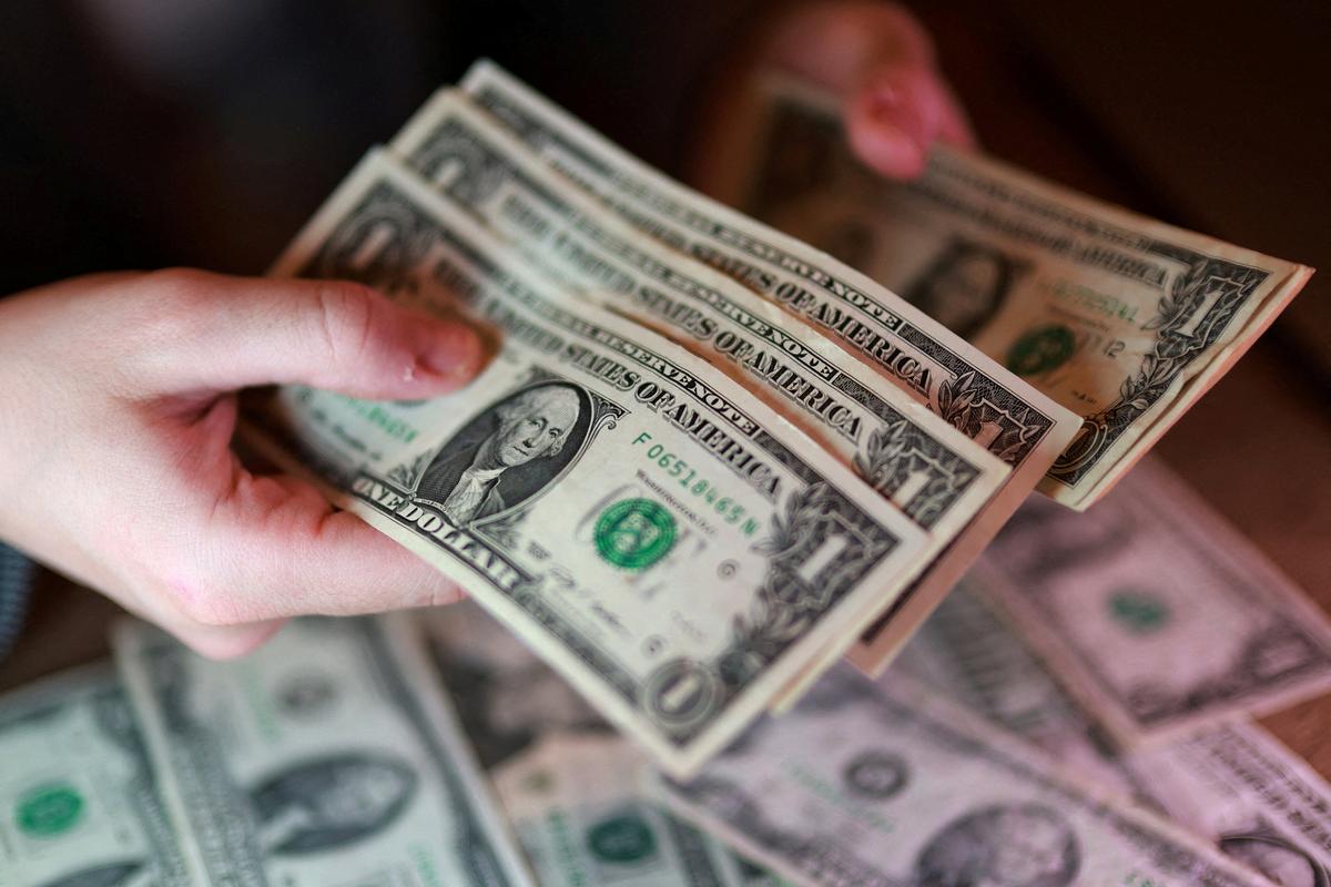 FILE PHOTO: U.S. dollar banknotes are seen in this illustration taken March 24, 2026. REUTERS/Dado Ruvic/Illustration/File Photo
