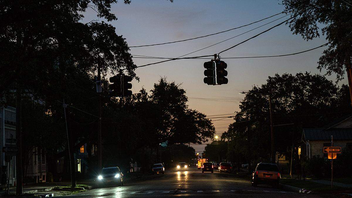 Damaged power lines over a darkened street