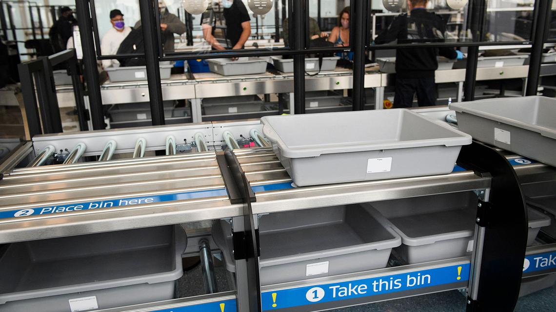 Travelers enter a new Transportation Security Administration screening area during the opening of the Terminal 1 expansion at Los Angeles International Airport on June 4, 2021, in Los Angeles.