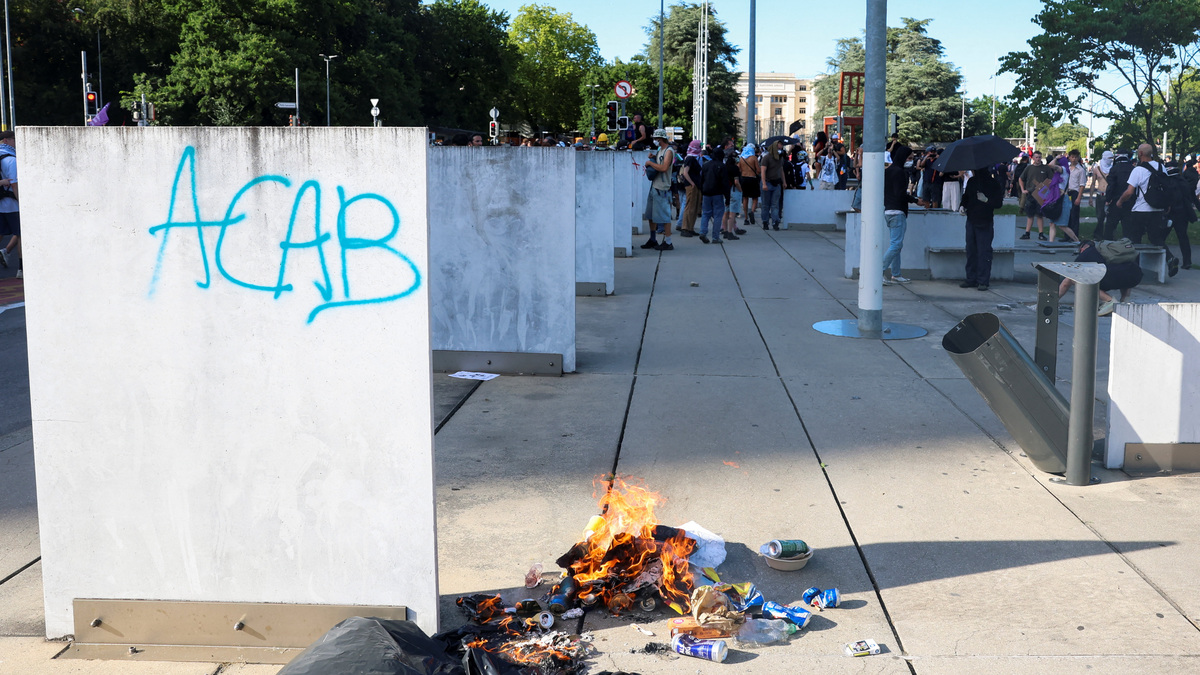 A pile of trash burns on the ground during a protest against the upcoming G7 summit in Evian-les-Bains in France, in Geneva, Switzerland, June 14, 2026. REUTERS/Denis Balibouse