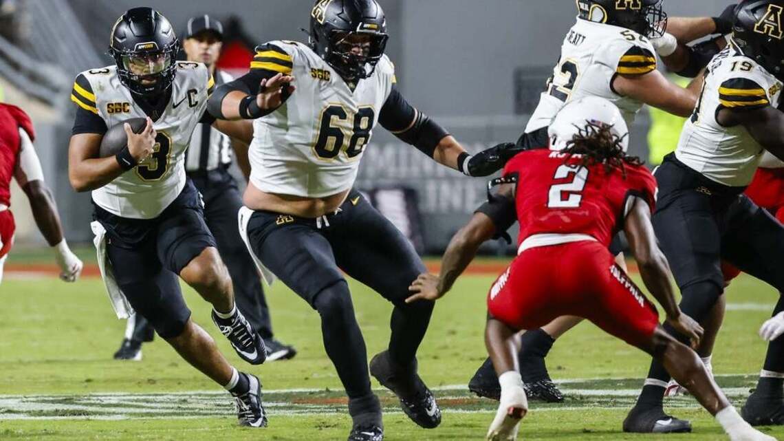 NC State blows 21-point lead but survives App State 