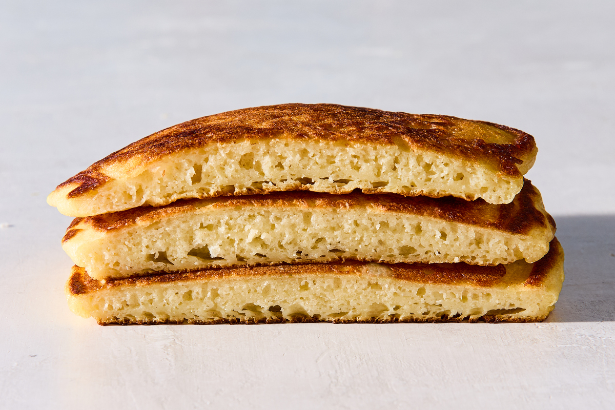 Buttermilk pancakes after letting the batter rest for 10 minutes. If you haven't let the batter rest, those first few pancakes will turn out too thin, with the batter running all over the pan. Food Stylist: Monica Pierini. (Julia Gartland/The New York Times)