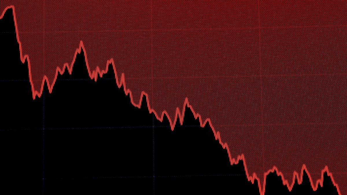 A screen displays a stocks chart in this file photo dated March 22, 2019. REUTERS/Brendan McDermid