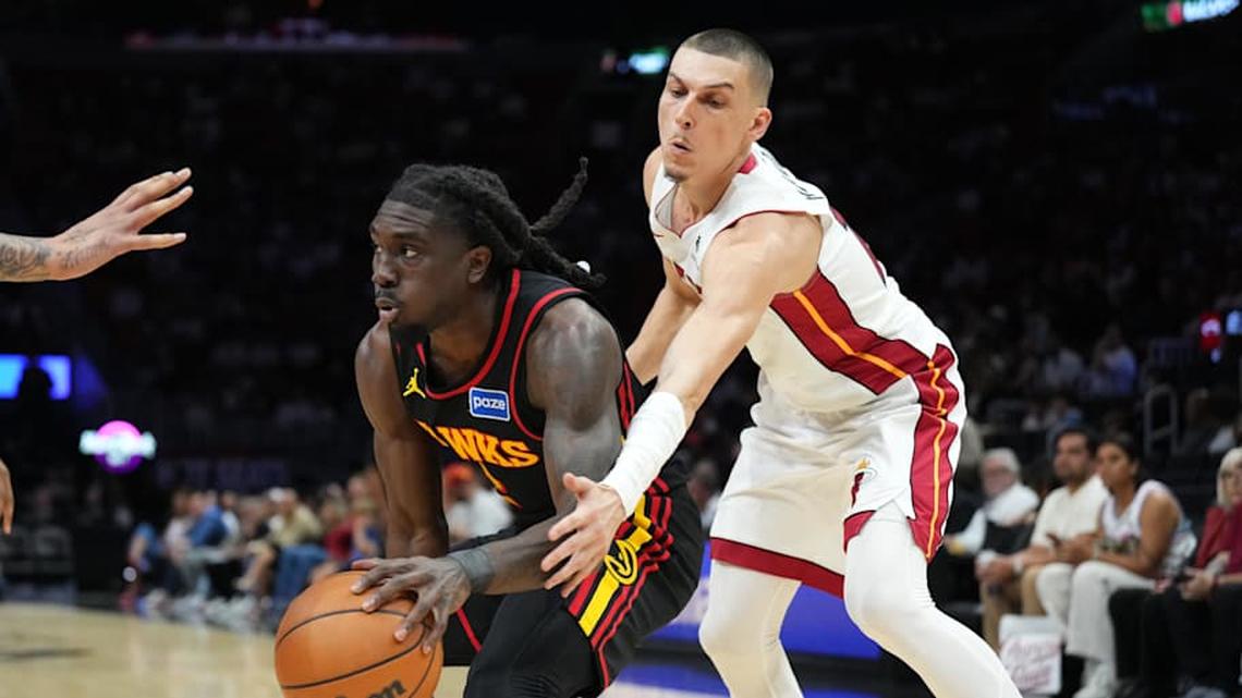  Apr 12, 2026; Miami, Florida, USA; Atlanta Hawks guard Keaton Wallace (2) drives past Miami Heat guard Tyler Herro (14) during the first half at Kaseya Center. Mandatory Credit: Jim Rassol-Imagn Images | Jim Rassol-Imagn Images 