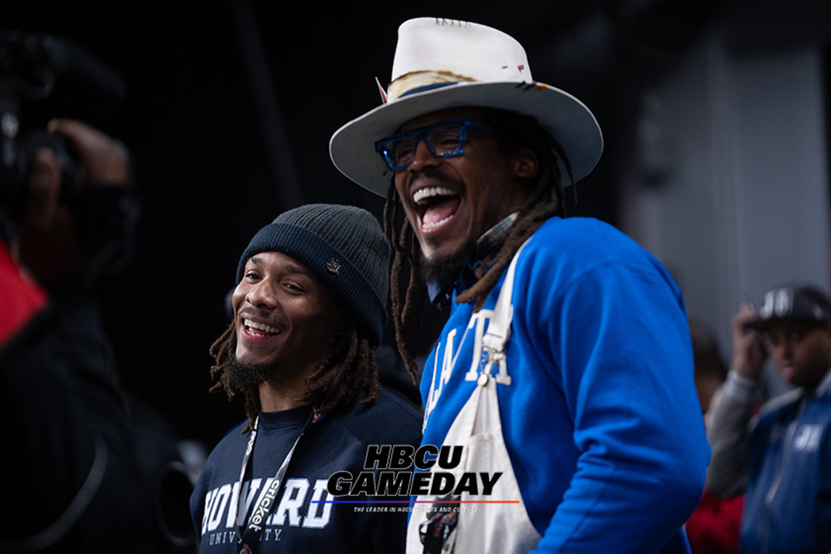 Cam Newton watches the 2023 Celebration Bowl with brother Caylin Newton. (Steven J. Gaither/HBCU Gameday photo)
