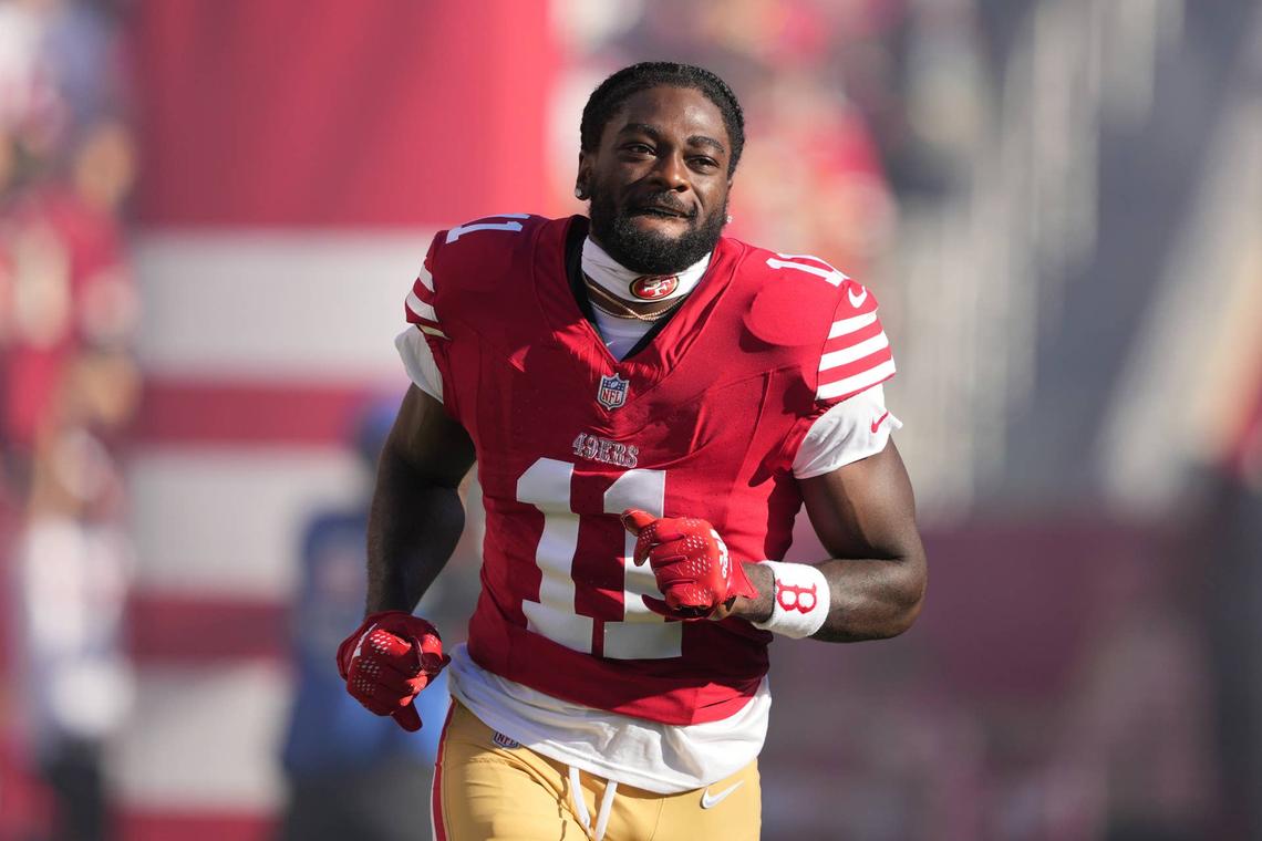  Sep 9, 2024; Santa Clara, California, USA; San Francisco 49ers wide receiver Brandon Aiyuk (11) is introduced to the crowd before the game against the New York Jets at Levi's Stadium. Mandatory Credit: Darren Yamashita-Imagn Images 