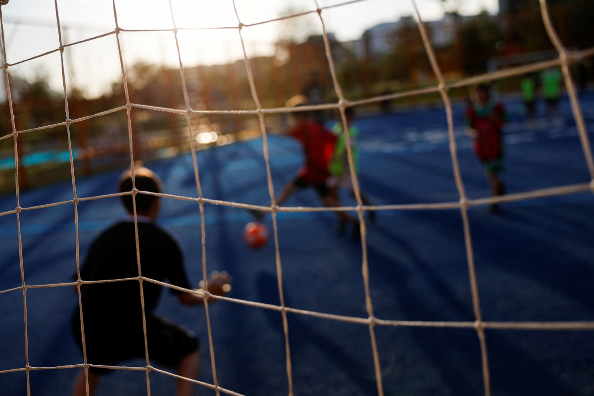 Children play soccer in Liberty Park, built on the former Topo Chico prison in Monterrey, where dozens died in a 2016 massacre, as residents celebrate renewed safety while pushing to preserve the transformed space, in Monterrey, Mexico, May 12, 2026. REUTERS/Daniel Becerril