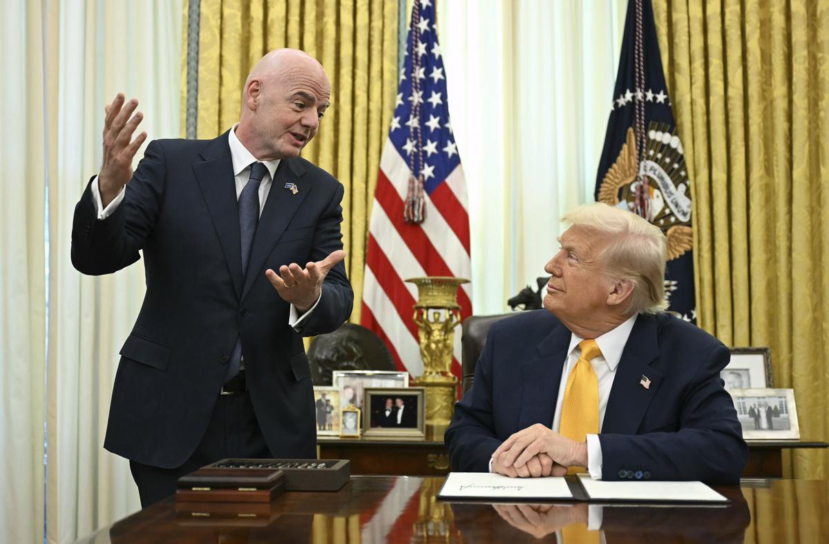  President Donald Trump, right, and FIFA President Gianni Infantino speak after Trump signed an executive order in the Oval Office of the White House in Washington on March 7, 2025. 