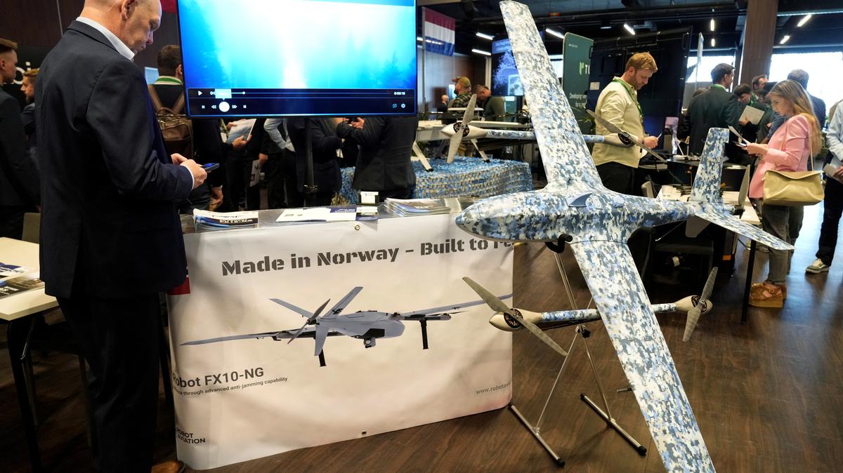 A man stands next to Robot Aviation's FX10NG drone displayed during the international Drone Summit in Riga, Latvia May 27, 2026. REUTERS/Ints Kalnins