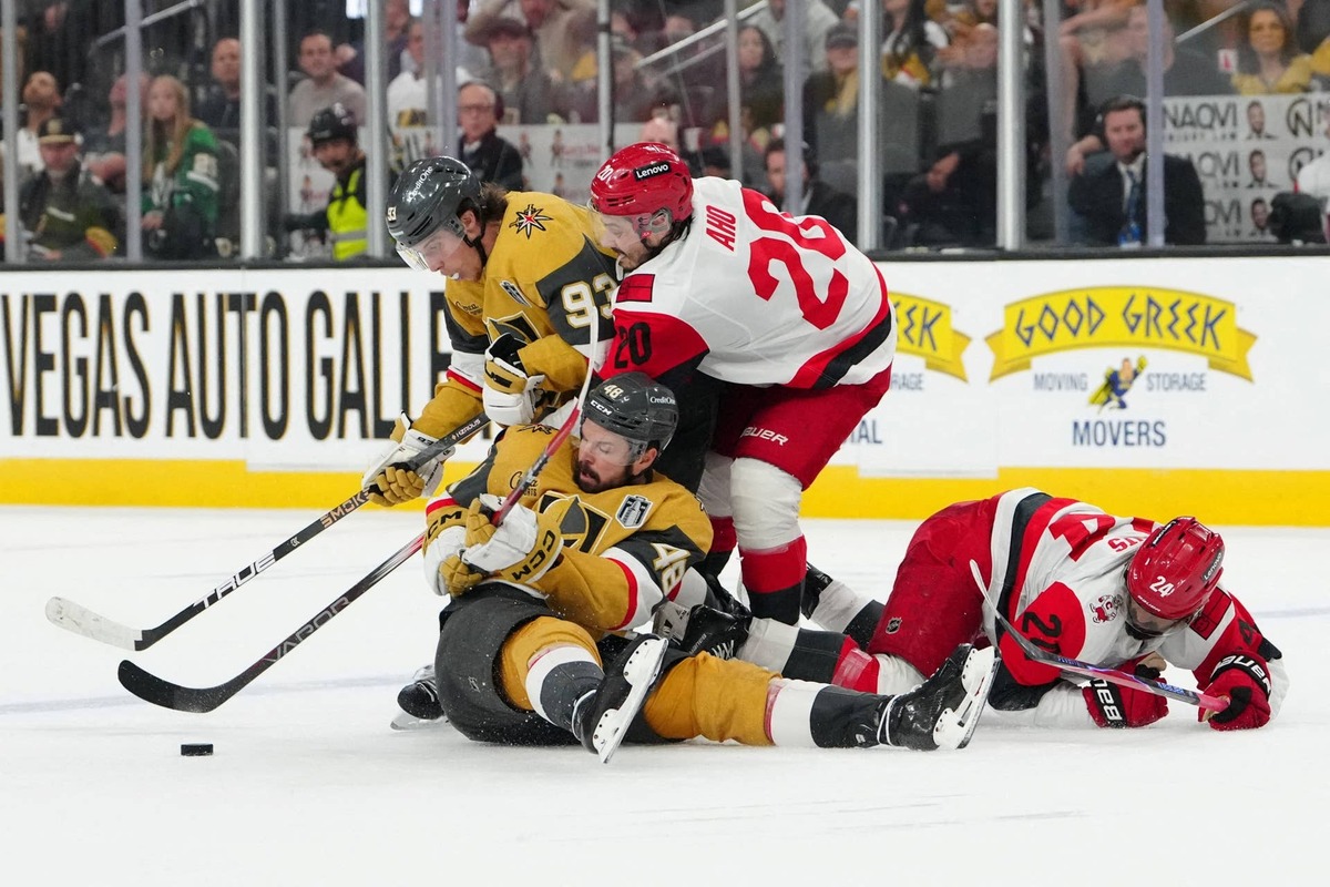  Carolina Hurricanes center Sebastian Aho (20) reaches for the puck against Vegas Golden Knights right wing Mitch Marner (93) an right wing Mark Stone (61) during the third period in game six of the 2026 Stanley Cup Final at T-Mobile Arena. Stephen R. Sylvanie-Imagn Images