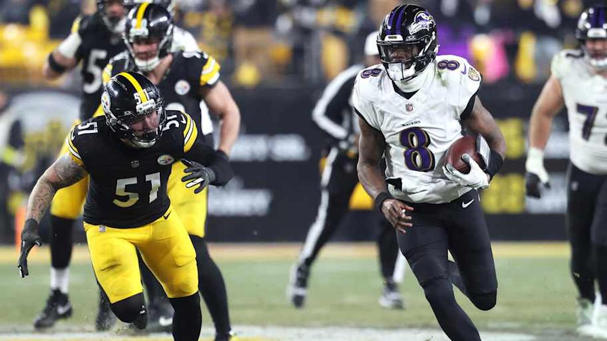  Jan 4, 2026; Pittsburgh, Pennsylvania, USA; Baltimore Ravens quarterback Lamar Jackson (8) rushes the ball past Pittsburgh Steelers linebacker Nick Herbig (51) during the first half at Acrisure Stadium. Mandatory Credit: Charles LeClaire-Imagn Images | Charles LeClaire-Imagn Images 