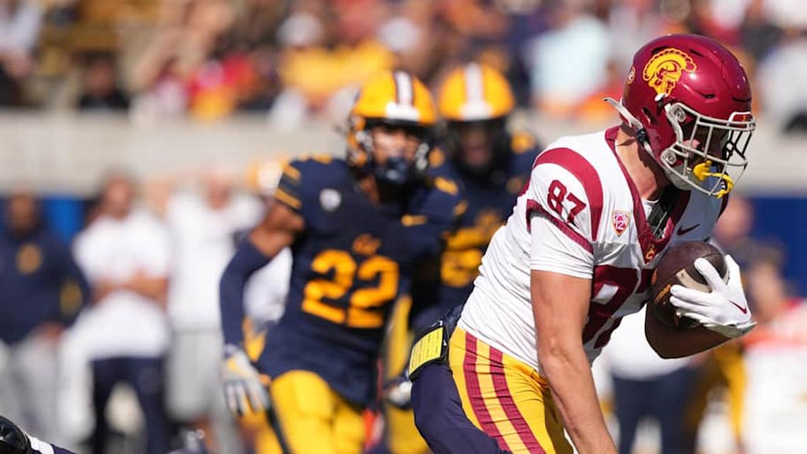  Oct 28, 2023; Berkeley, California, USA; USC Trojans tight end Lake McRee (87) runs after a catch against California Golden Bears defensive back Craig Woodson (2) during the first quarter at California Memorial Stadium. Mandatory Credit: Darren Yamashita-Imagn Images | Darren Yamashita-Imagn Images 
