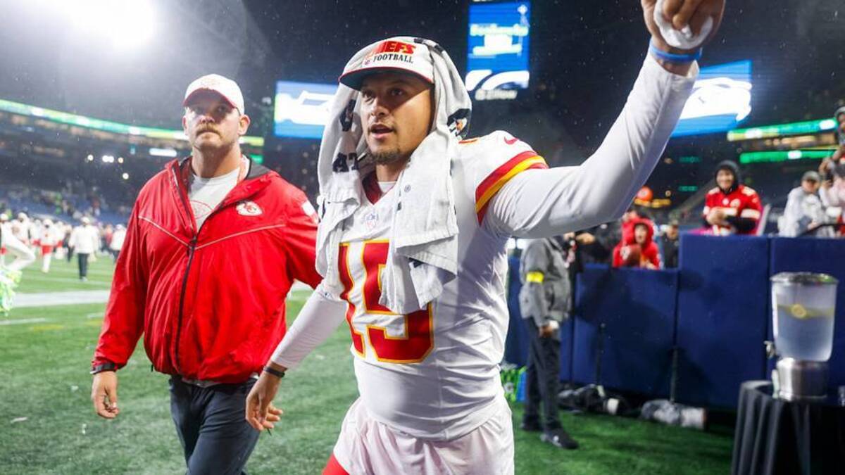  Aug 15, 2025; Seattle, Washington, USA; Kansas City Chiefs quarterback Patrick Mahomes (15) bumps fists with a fan following a loss against the Seattle Seahawks at Lumen Field. Mandatory Credit: Joe Nicholson-Imagn Images | IMAGN IMAGES via Reuters Connect 