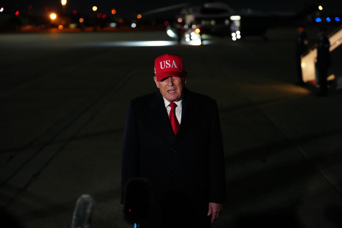 President Donald Trump speaks to reporters after disembarking Air Force One at Joint Base Andrews in Maryland, on Sunday, April 12, 2026. (Tierney L. Cross/The New York Times)