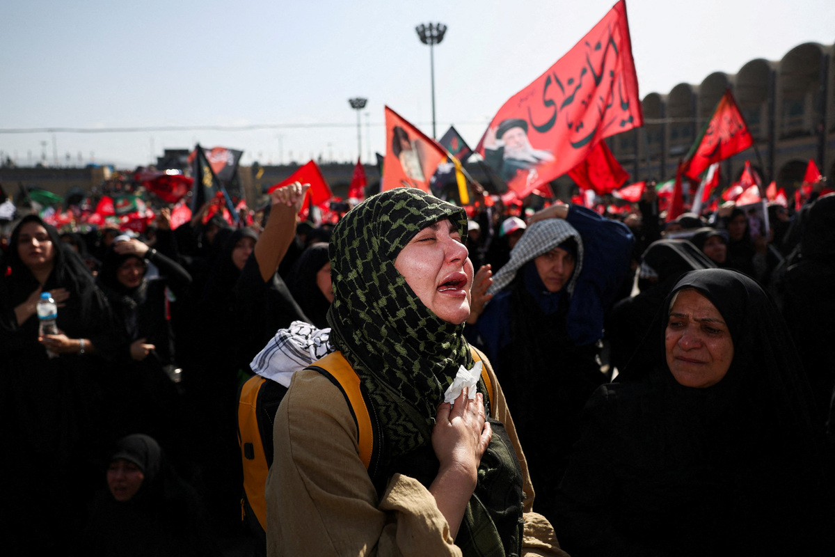 A woman reacts as mourners gather on the day of a public farewell ceremony to pay their respects to late Supreme Leader Ayatollah Ali Khamenei, who was killed on February 28 in Israeli and U.S. airstrikes, at the Imam Khomeini Grand Mosalla, in Tehran, Iran July 4, 2026.  Majid Asgaripour/WANA (West Asia News Agency) via REUTERS