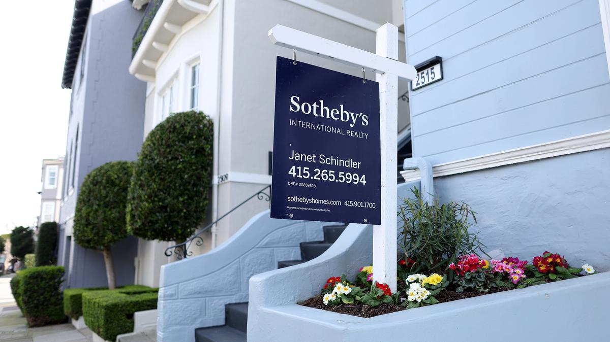 A for sale sign is posted in front of a home for sale on Feb. 20, 2023, in San Francisco. San Francisco’s luxury market is characterized these days by bidding wars and scarce inventory.  (Justin Sullivan/Getty Images/TNS)