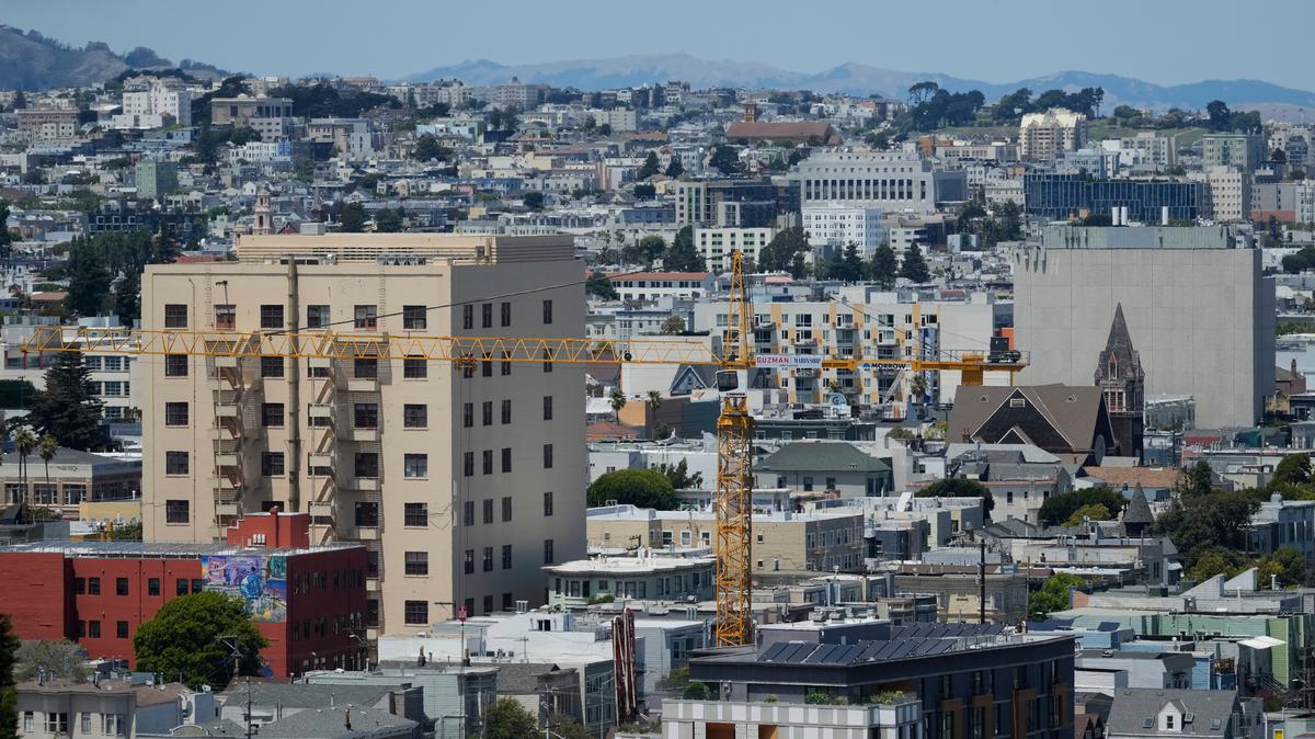 California Homes-Construction Insurance. A crane rises at a construction site for a new housing development in San Francisco, on July 18, 2025.