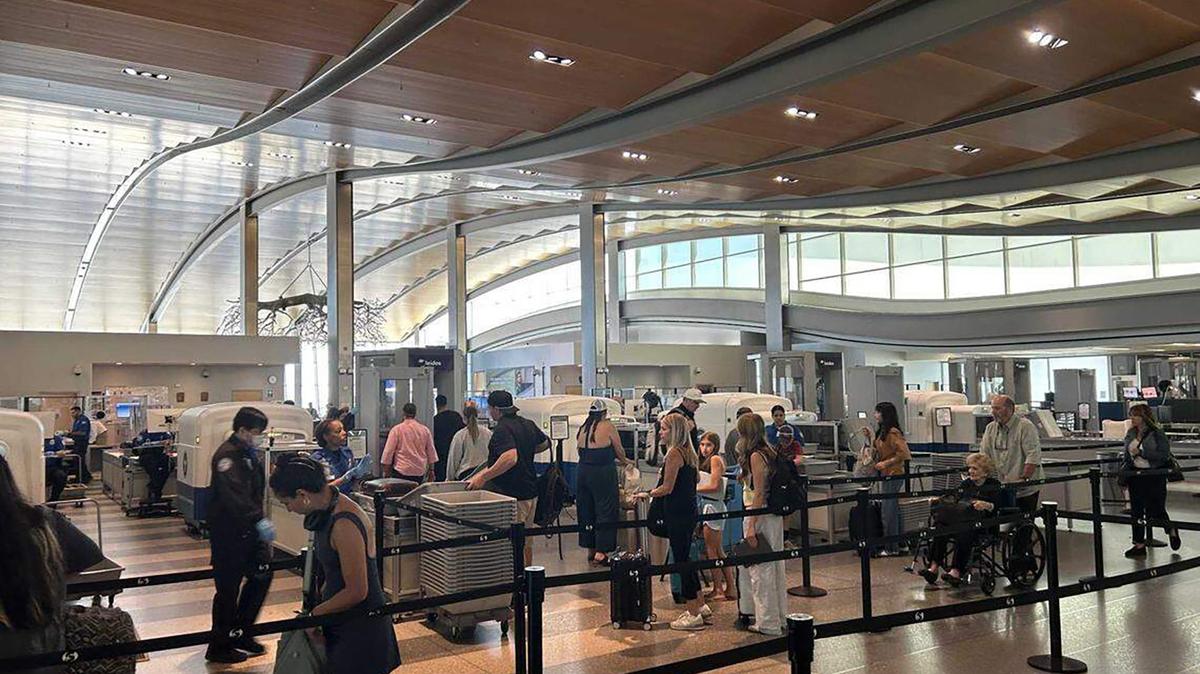 Travelers pass through the Terminal B security checkpoint at Sacramento International Airport on July 8, 2025. (Ethan Wolin/The Sacramento Bee/TNS)