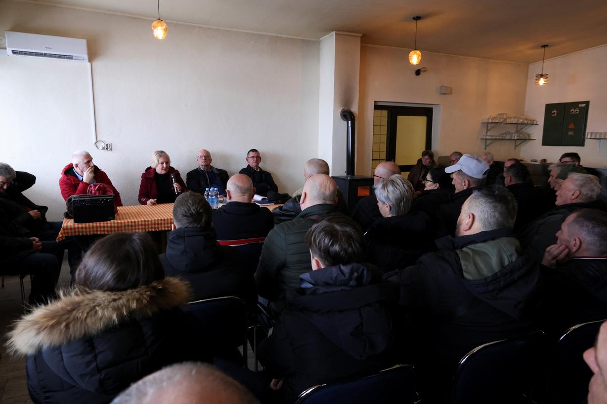 Concerned residents of the village of Przici attend a meeting where the harmful effects of lead in the body are demonstrated, in Vares, Bosnia and Herzegovina, February 21, 2026. Recent tests have detected lead in the blood of more than 300 nearby residents, fueling fear and uncertainty about the future of the town. REUTERS/Amel Emric