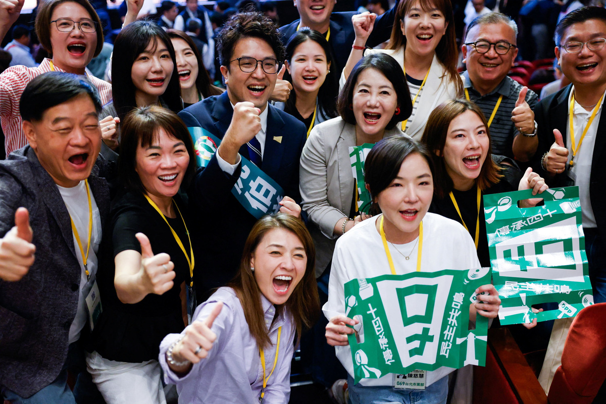 Democratic Progressive Party (DPP) lawmaker Puma Shen, the party's candidate for Taipei mayor, poses for a group photo with supporters and fellow lawmakers during the annual congress of the ruling Democratic Progressive Party (DPP) in Taipei, Taiwan, July 19, 2026. REUTERS/Ann Wang