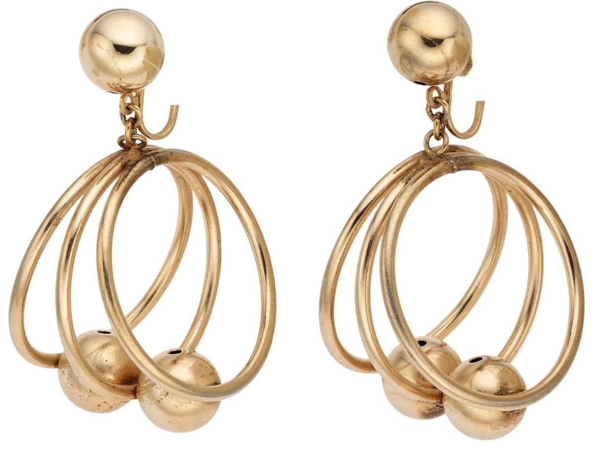  Triple-hoop pendant earrings worn by the actress in September 1954 when she arrived at New York's Idlewild Airport to begin work on "The Seven Year Itch." (Heritage Auctions via SWNS) 