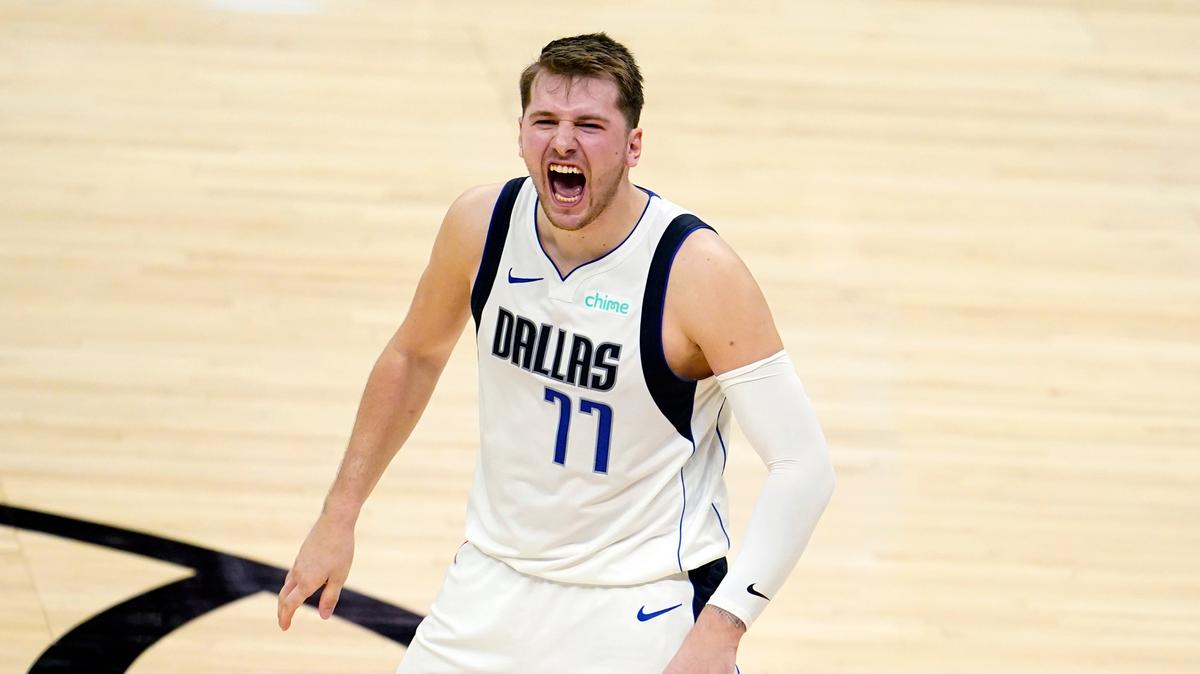 Dallas Mavericks guard Luka Doncic celebrates after a dunk by Kristaps Porzingis during the second half in Game 2 of the team’s NBA basketball first-round playoff series against the Los Angeles Clippers on Tuesday, May 25, 2021, in Los Angeles. (AP Photo/Marcio Jose Sanchez)