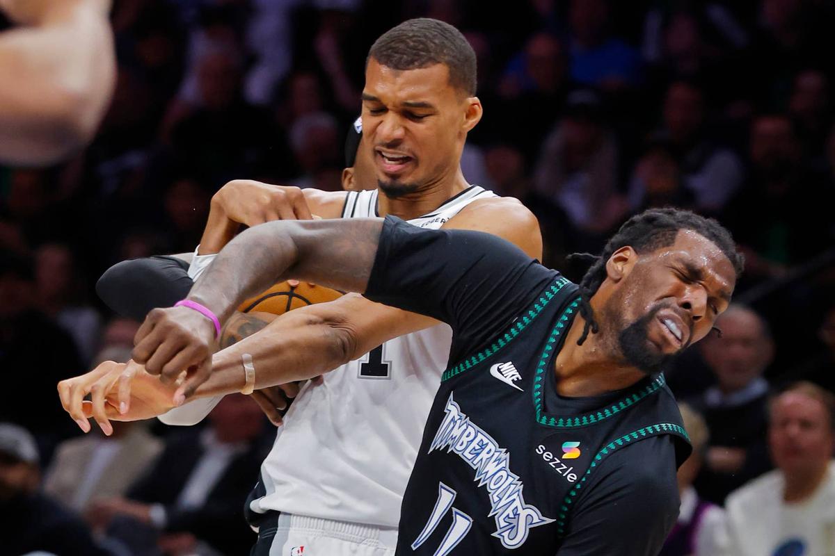  San Antonio Spurs center Victor Wembanyama (1) commits a Flagrant 2 foul against Minnesota Timberwolves center Naz Reid (11). Mandatory Credit: Bruce Kluckhohn-Imagn Images