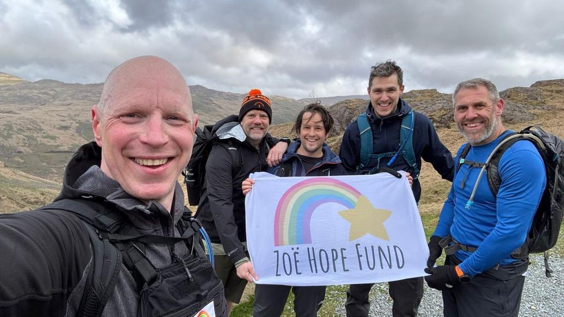 Dad climbs 3 mountains while carrying weight of late daughter