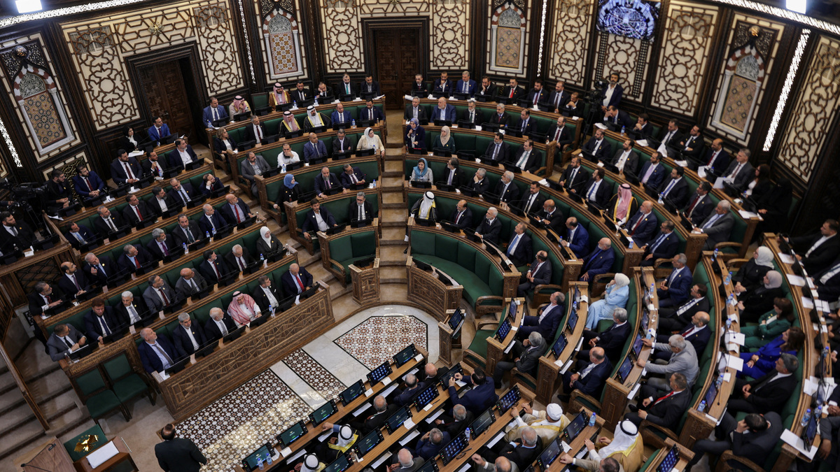 Members of Syria's newly formed People's Assembly attend the body's inaugural session, the first parliament session since the end of the rule of ousted Syrian President Bashar al-Assad, in Damascus, Syria, July 12, 2026. REUTERS/Khalil Ashawi