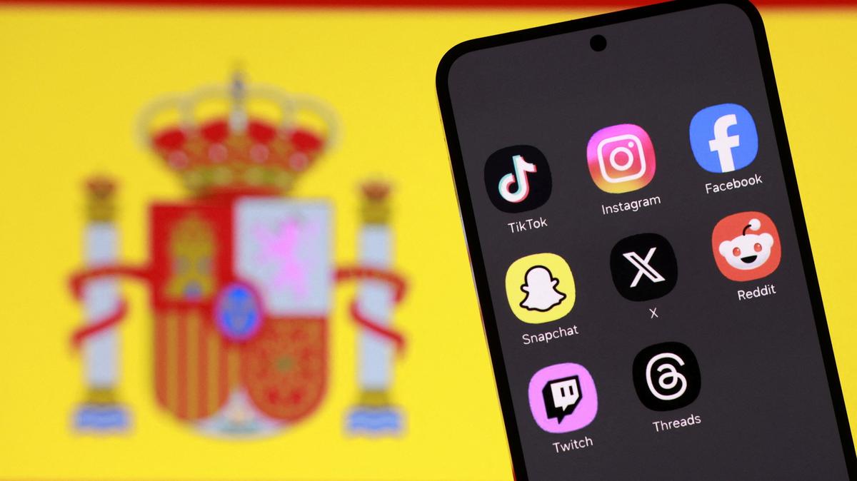 A Spanish flag and smartphone with displayed social media app icons are seen in this illustration taken February 3, 2026. REUTERS/Dado Ruvic/Illustration