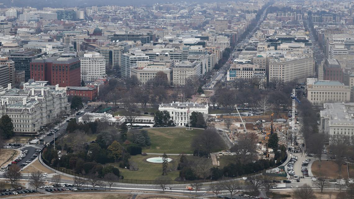Viewed from the observation level of the Washington Monument, demolition work continues where the East Wing once stood at the White House on Jan. 5, 2026, in Washington, D.C. President Donald Trump ordered the 123-year-old East Wing and Jacqueline Kennedy Garden to be leveled to make way for a new 90,000-square-foot ballroom, which he says will cost around $400 million and will be funded with private donations. (Heather Diehl/Getty Images/TNS)
