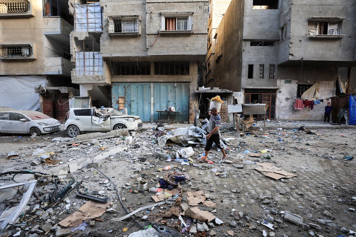 A Palestinian man walks at the site of an Israeli strike on an apartment in Gaza City, June 4, 2026. REUTERS/Dawoud Abu Alkas