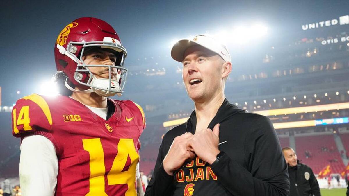  Nov 29, 2025; Los Angeles, California, USA; Southern California Trojans quarterback Jayden Maiava (14) and head coach Lincoln Riley react after the game against the UCLA Bruins at United Airlines Field at Los Angeles Memorial Coliseum. Mandatory Credit: Kirby Lee-Imagn Images | Kirby Lee-Imagn Images 