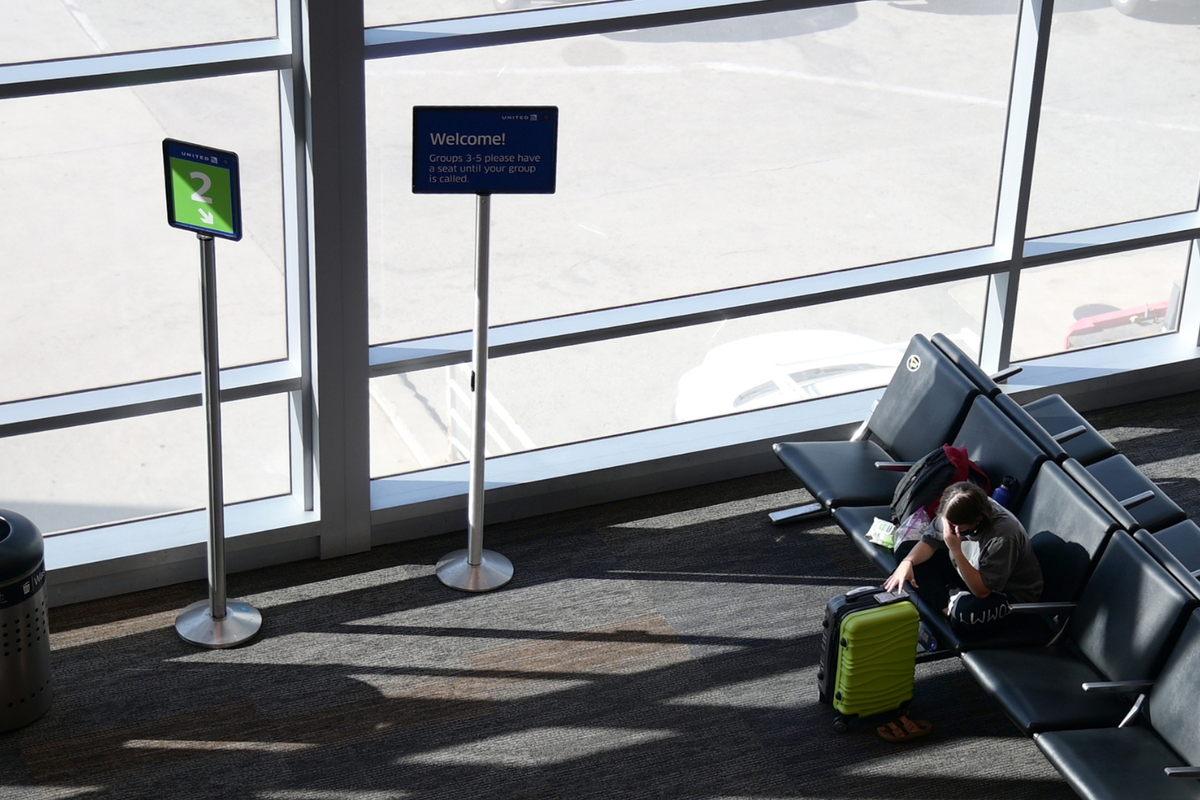  An air traveler waiting at the empty gate at San Francisco International Airport on October 27, 2020 in San Francisco, California. 