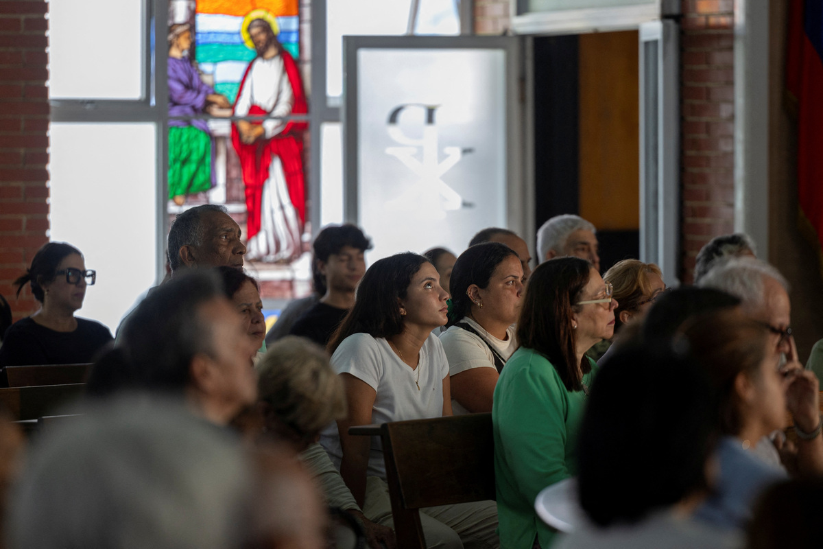 Survivor Maria Alejandra Sanz attends a memorial service at Maria Auxiliadora Church for one of her friends who was killed when twin earthquakes struck La Guaira, in Caracas, Venezuela, July 7, 2026. REUTERS/Ricardo Arduengo