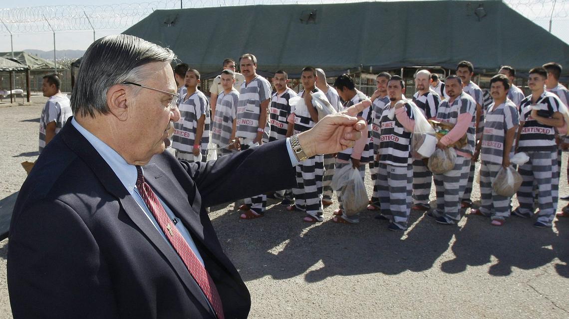 Maricopa County Sheriff Joe Arpaio orders undocumented immigrants handcuffed together and moved into a separate area of Tent City in Phoenix on Feb. 4, 2009. 